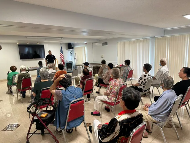Residents attending a presentation in the activity room